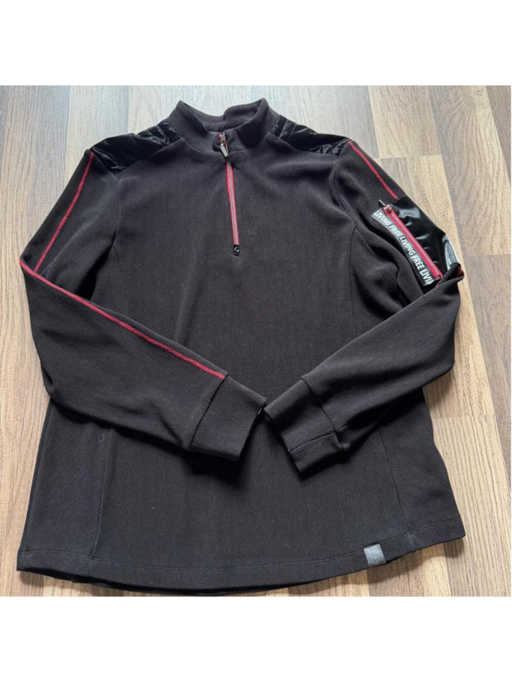 Black moto-inspired quarter zip sweater